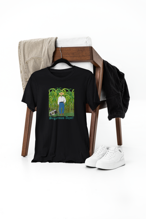 Black t-shirt with graphic design on a chair with jeans and sneakers.